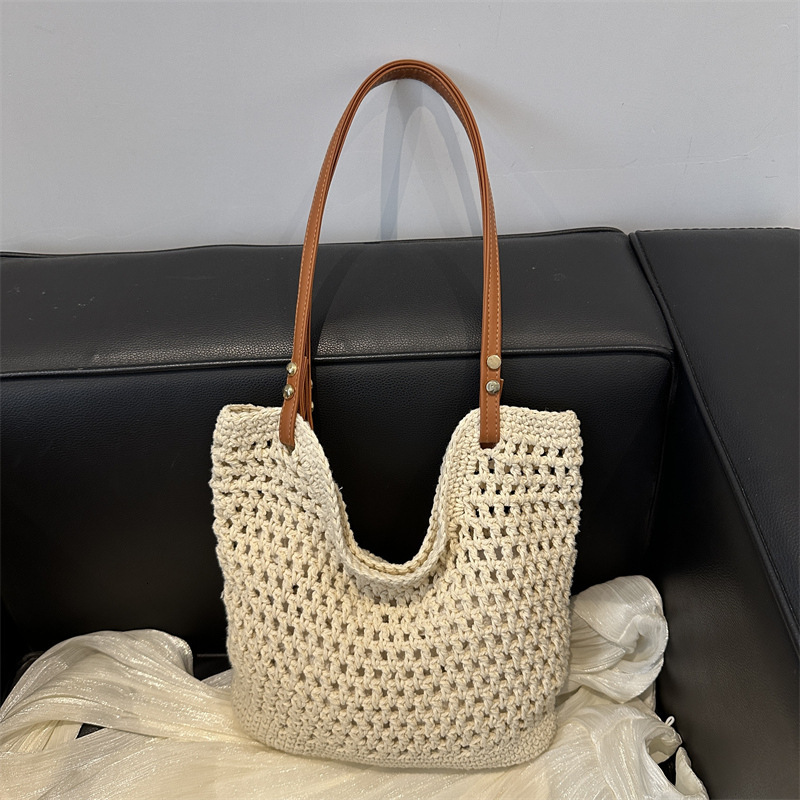 2025 new bag large capacity handmade designer women's grass woven beach vacation shoulder carrying commuting handbag