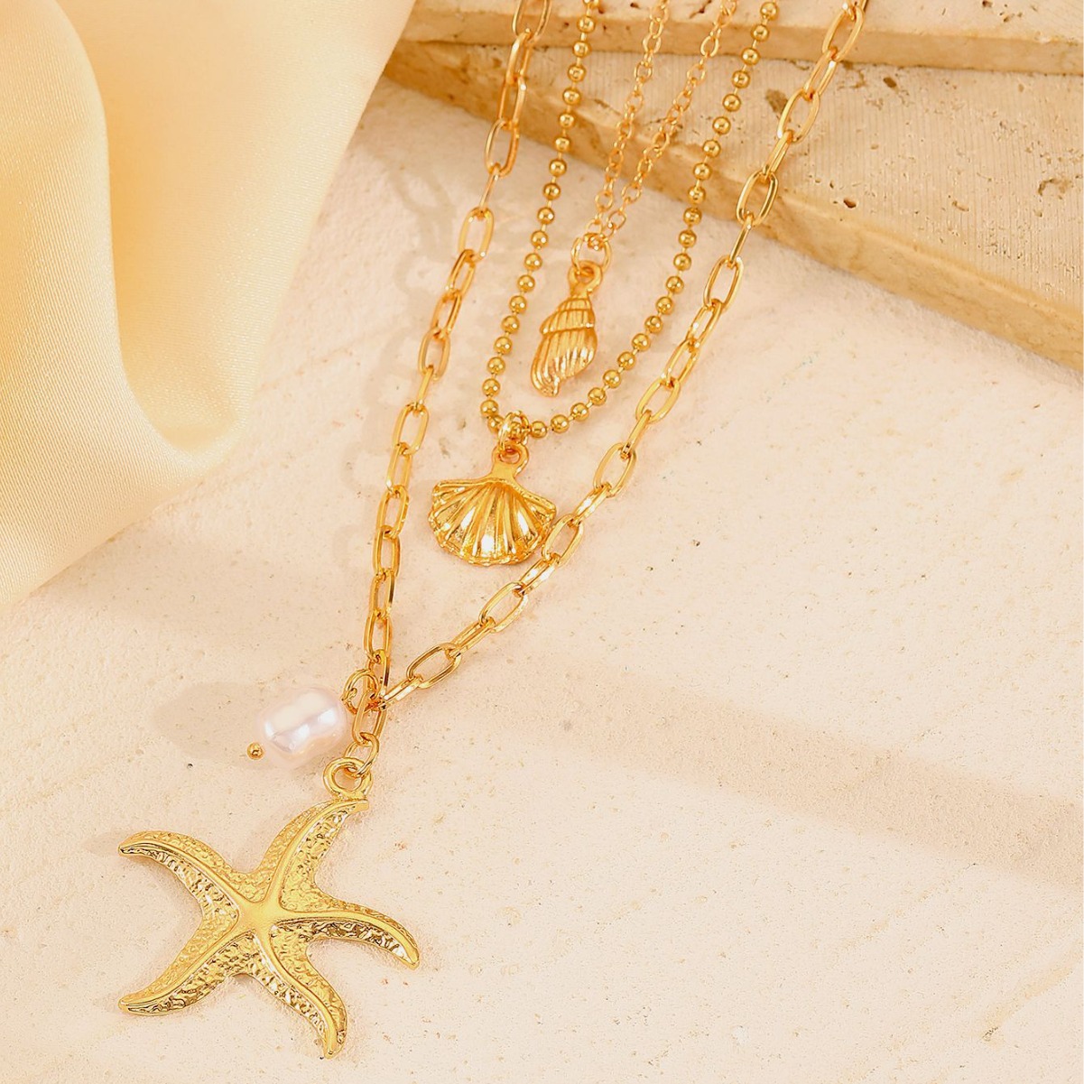 Chic Handcrafted Jewelry: Feminine 3-Dimensional Starfish + Pearl Accents Hanging from Fine-Golden Cords