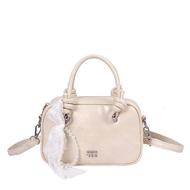 Light luxury hand-held small square women's 2025 summer new style temperament versatile shoulder internet famous trendy crossbody bag