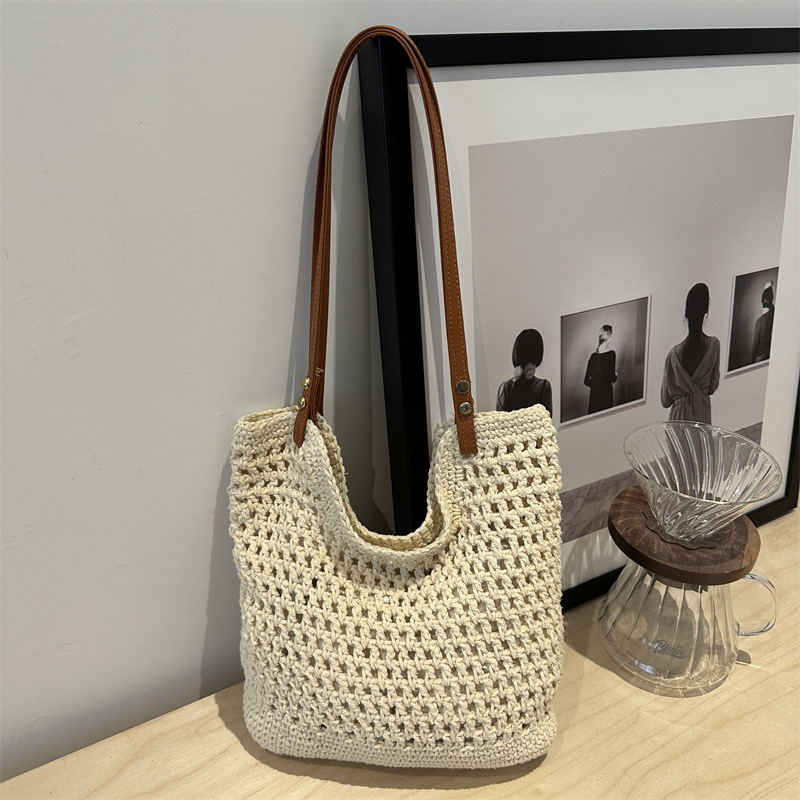 2025 new bag large capacity handmade designer women's grass woven beach vacation shoulder carrying commuting handbag