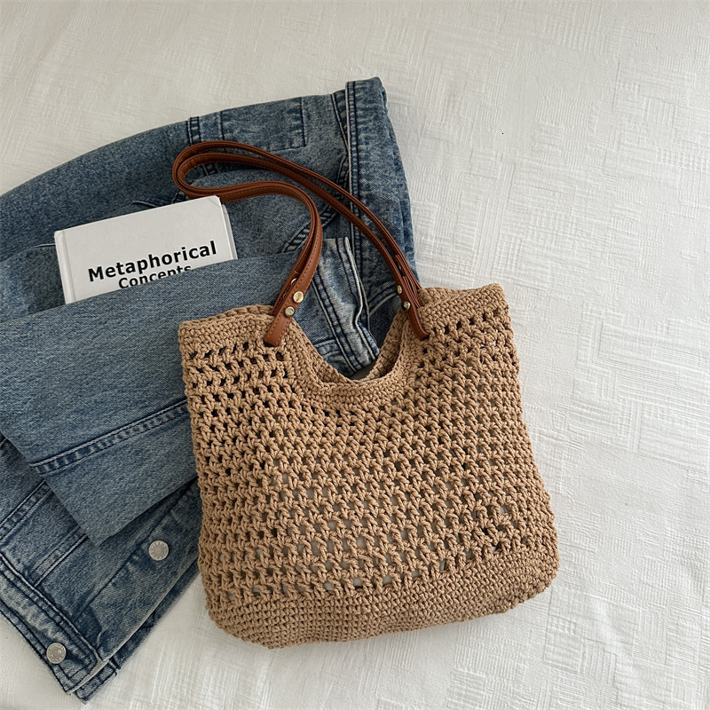 2025 new bag large capacity handmade designer women's grass woven beach vacation shoulder carrying commuting handbag
