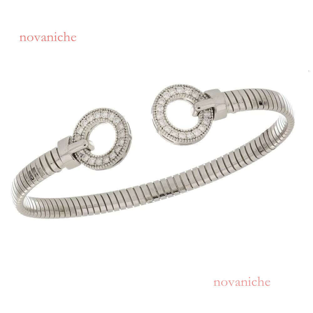 Made Italy, this elegant sier cuffed bracelet features circular micro paving details and is handmade in a modern style