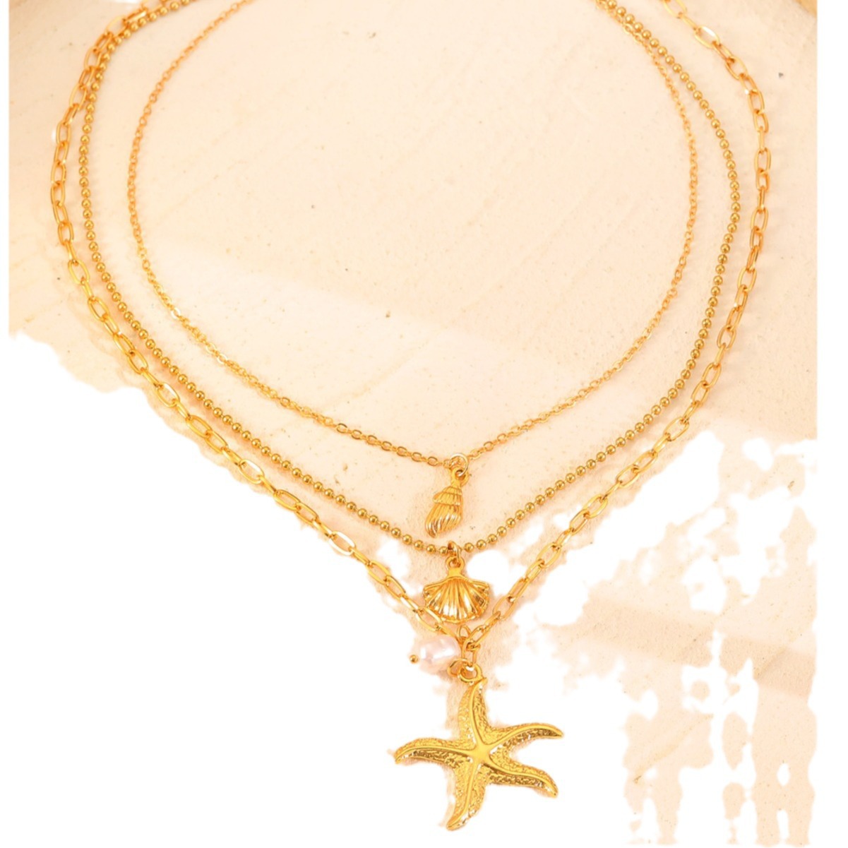 Chic Handcrafted Jewelry: Feminine 3-Dimensional Starfish + Pearl Accents Hanging from Fine-Golden Cords