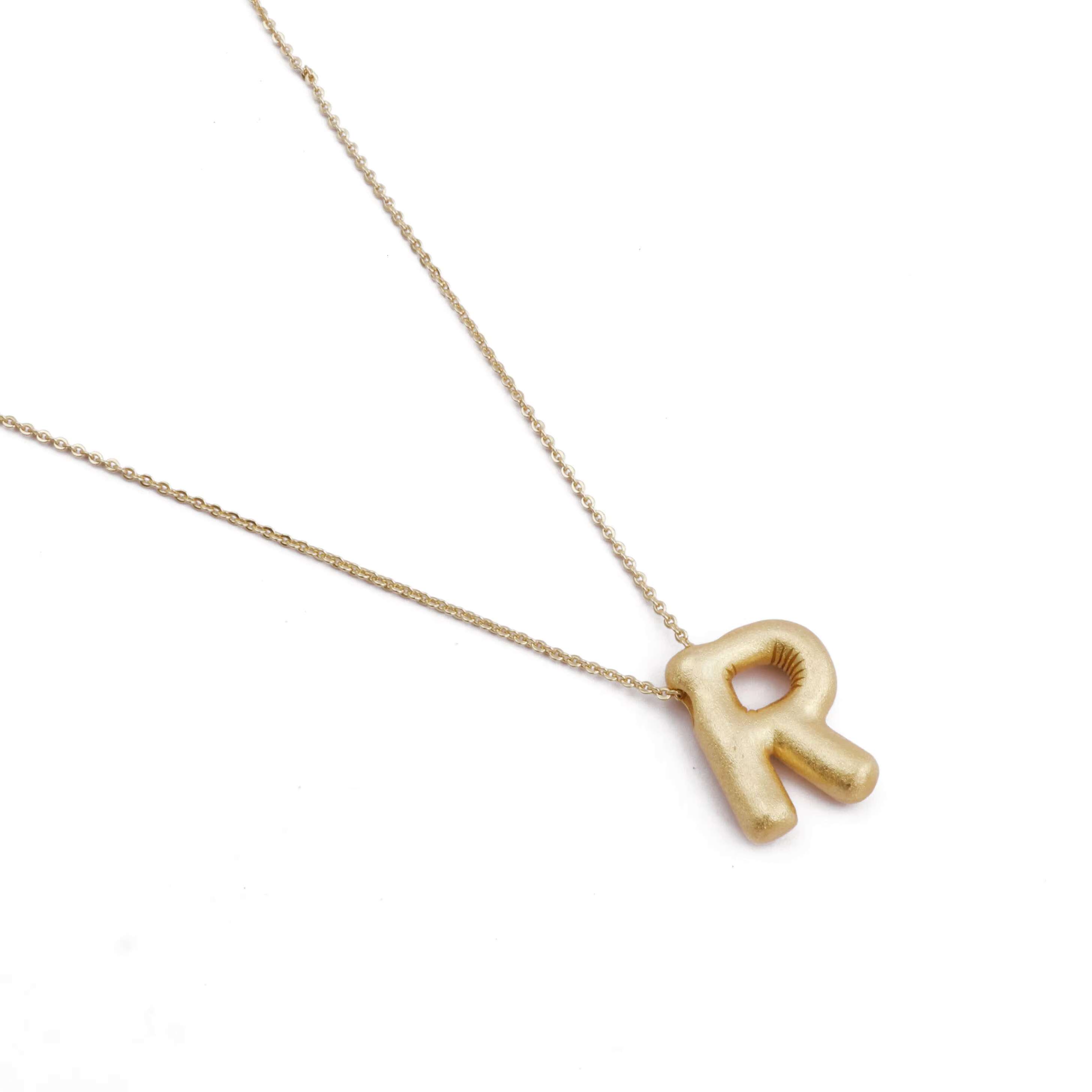 The R short chubby famous designer brand is the initial gold pendant necklace and gold-plated letter earrings for women