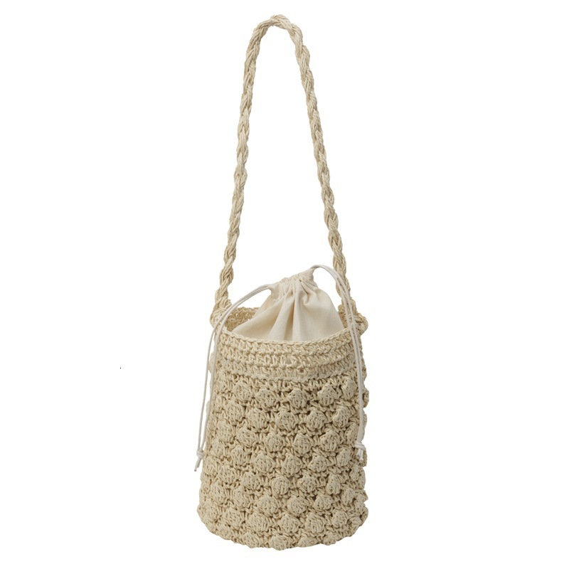 New cylindrical hand-held niche cute water bucket straw woven bag, beach vacation and leisure women's bag