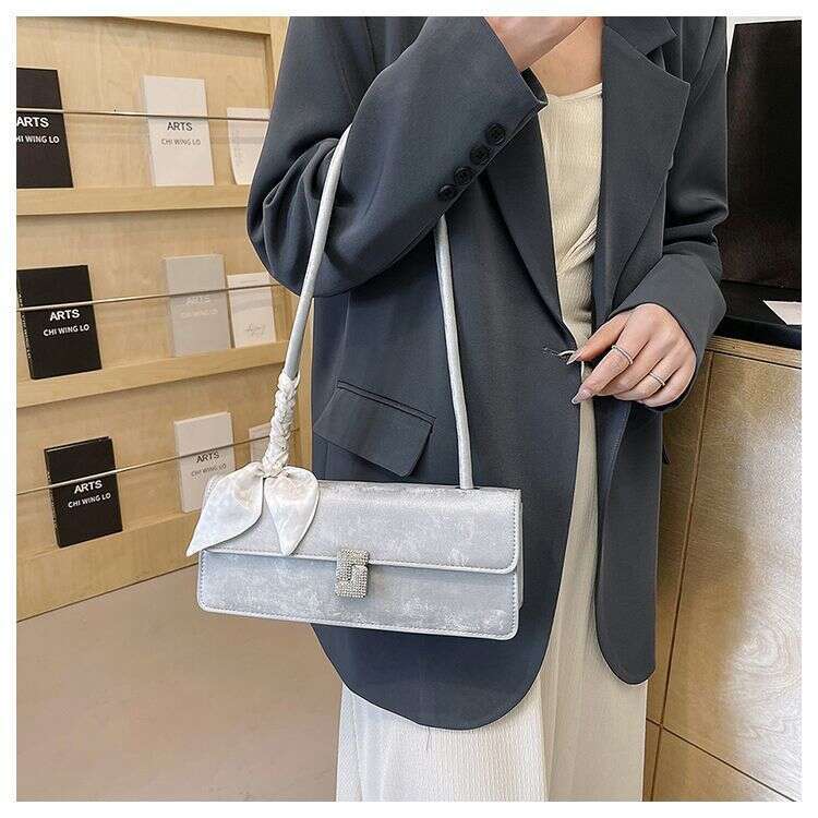 Advanced and stylish silver for women 2025 new French versatile single shoulder armpit bag fashionable hand-held stick bag