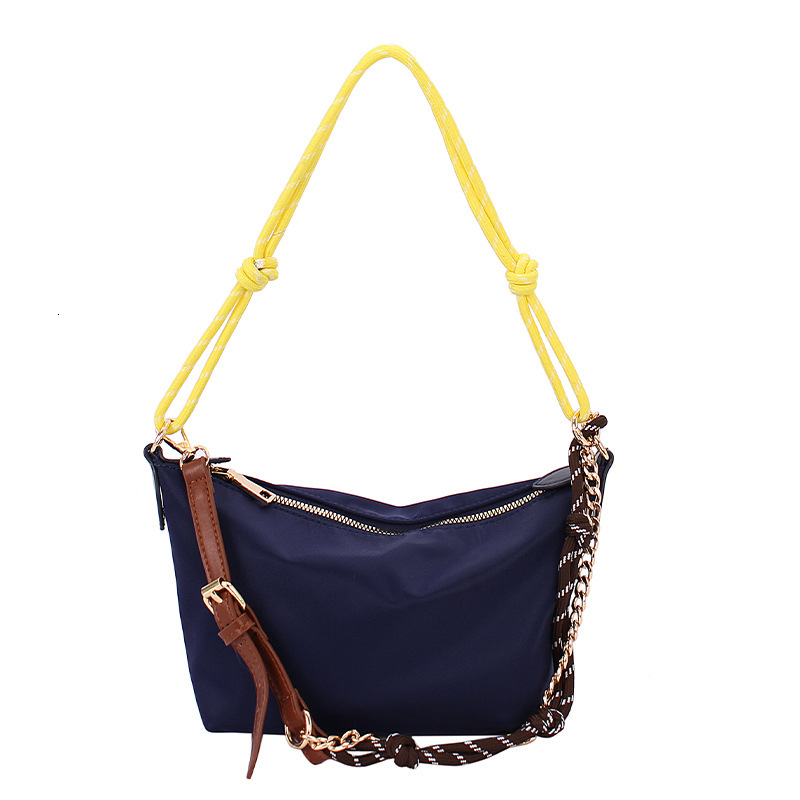 Extremely simple style hand-held gold ingot women's 2025 summer new fashion shoulder internet famous trend crossbody bag