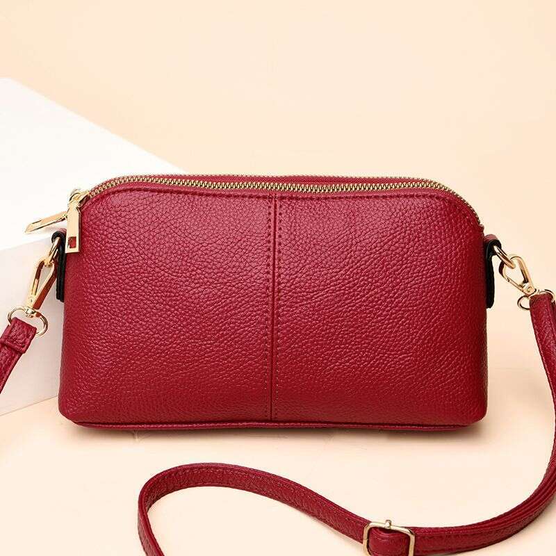 Handheld for women 2025 new fashion Korean version soft leather single shoulder versatile multi-layer small bag hand-held shell bag