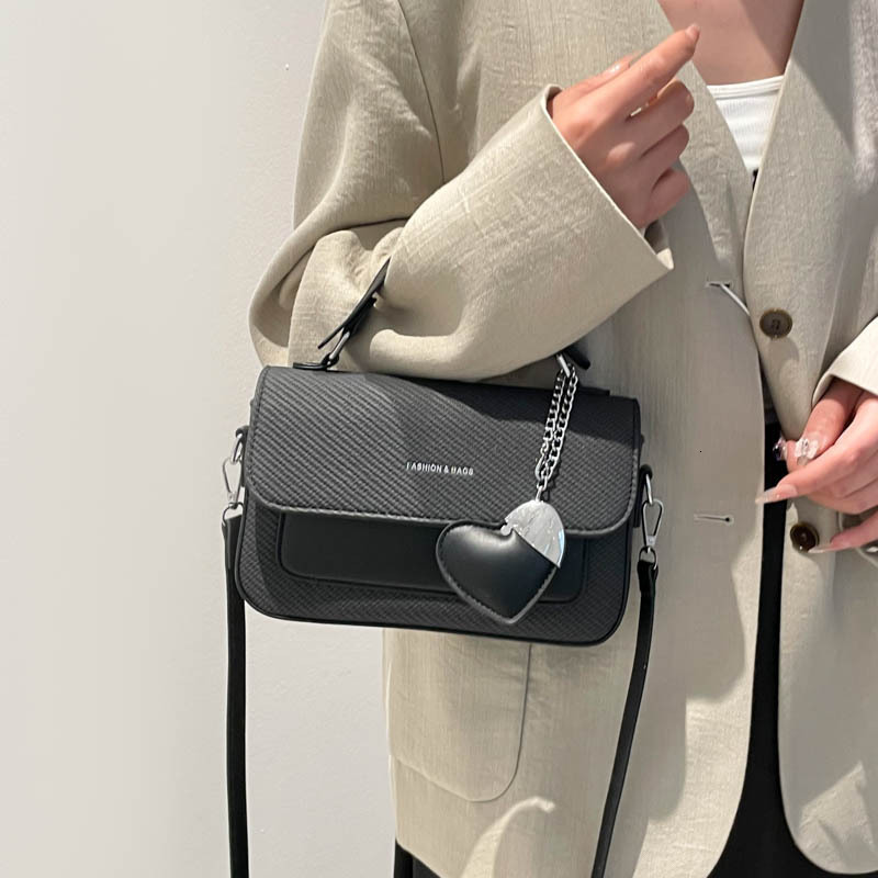 Fashion hand-held small square women's 2025 summer new style light luxury western-style shoulder commuting versatile crossbody bag