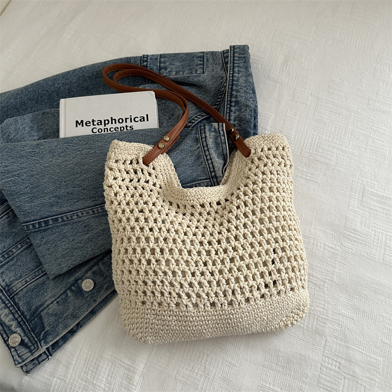2025 new bag large capacity handmade designer women's grass woven beach vacation shoulder carrying commuting handbag