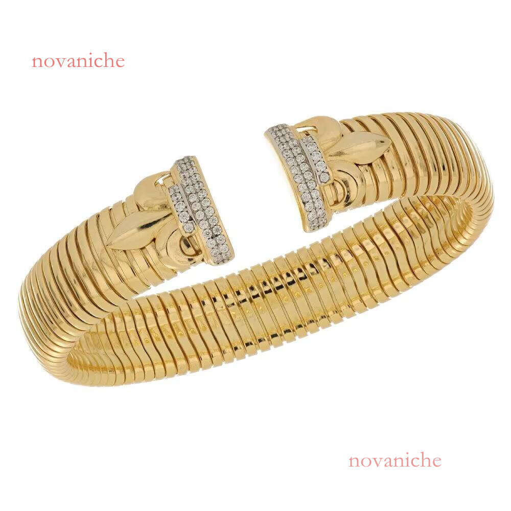 Made in Italy, luxurious handmade gold cuff bracelet with leaf decoration and sparkling microcrystalline CZ, elegant