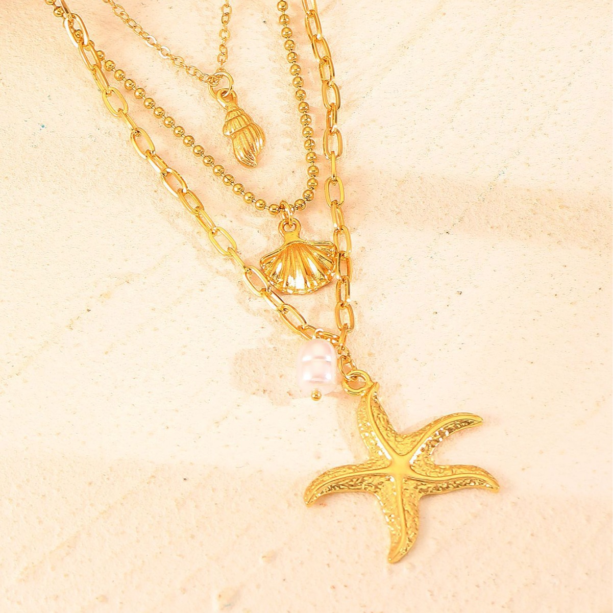Chic Handcrafted Jewelry: Feminine 3-Dimensional Starfish + Pearl Accents Hanging from Fine-Golden Cords