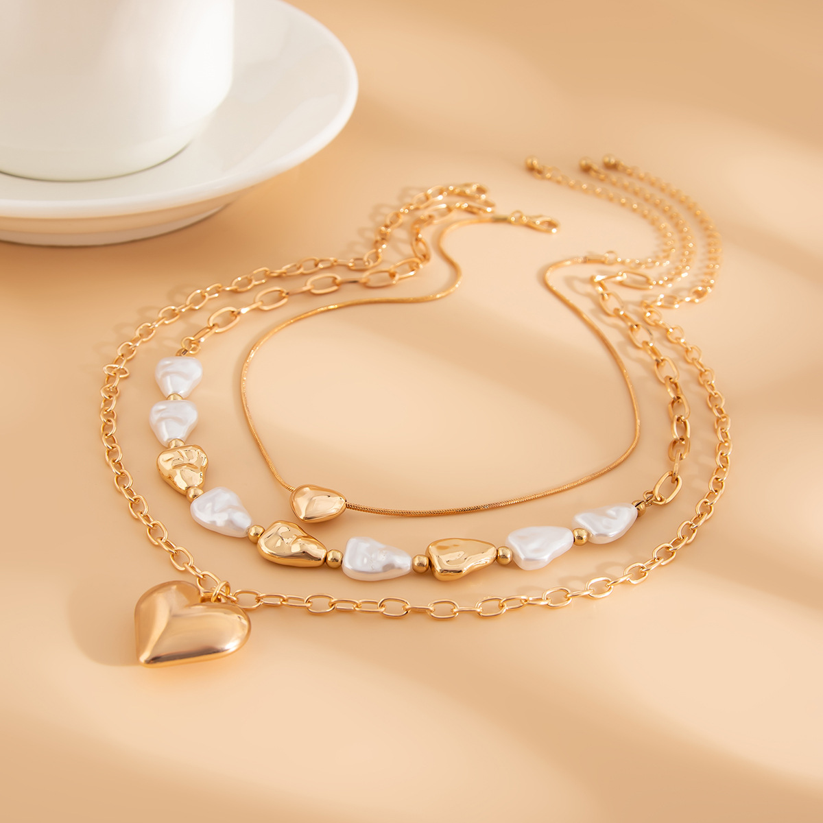 Fashionable Layered Heart Pendant Jewelry Set With Discreetly Placed Imitation Pearls