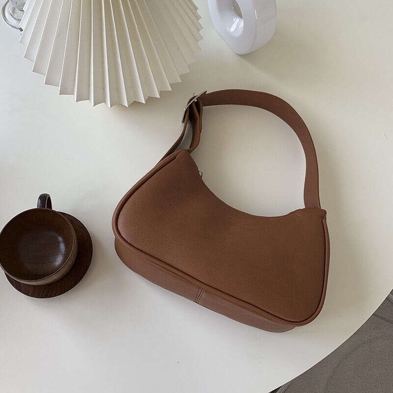 New niche shoulder Kendou style underarm baguette hand-held dumpling bag simple style
