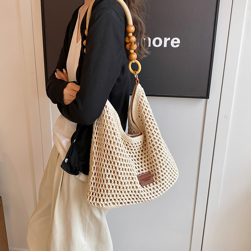 Beach vacation beach woven for women 2025 new hollow knitted handbag, large capacity single shoulder armpit bag