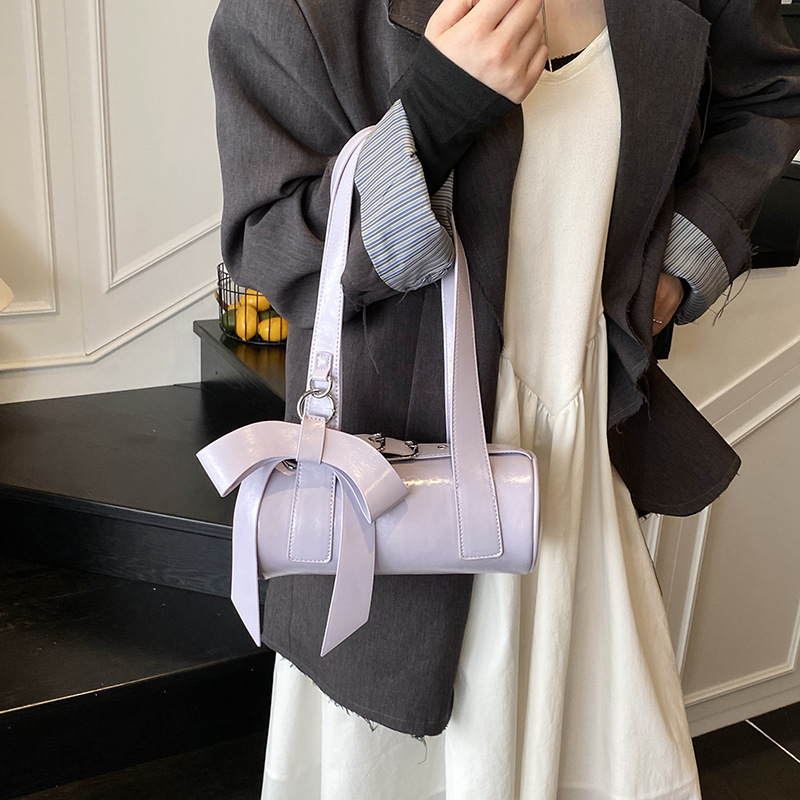 Niche bow hand-held small for women 2025 new trendy and fashionable texture armpit bag, summer minimalist baguette bag