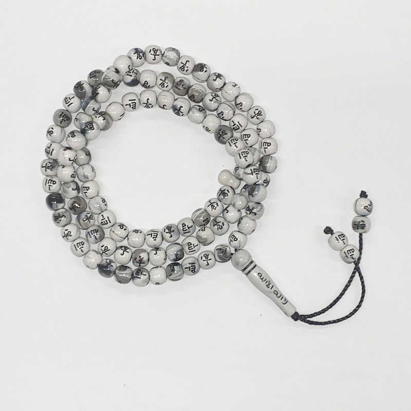 Muslim held in hand, counting 99 beads. Arabic bracelet prayer beads