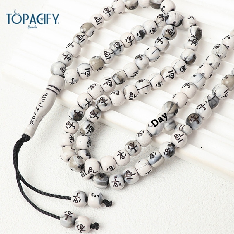 Muslim held in hand, counting 99 beads. Arabic bracelet prayer beads