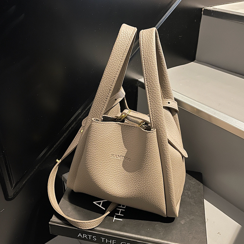 2025 Spring New Designer Bag New Women's Fashion Lychee Pattern Soft Leather Bucket Simple Multi functional Commuter Single Shoulder Maternal and