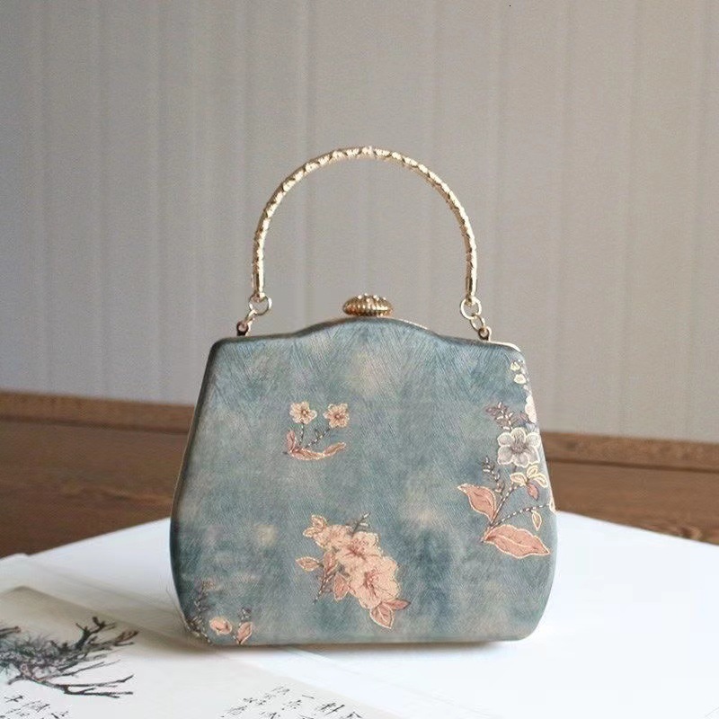 2025 New Style Bag Chinese Hanfu Retro Versatile High end Feeling Slanted Hanging Women's Designer Cheongsam Mouth Golden Small Round Bag Armband