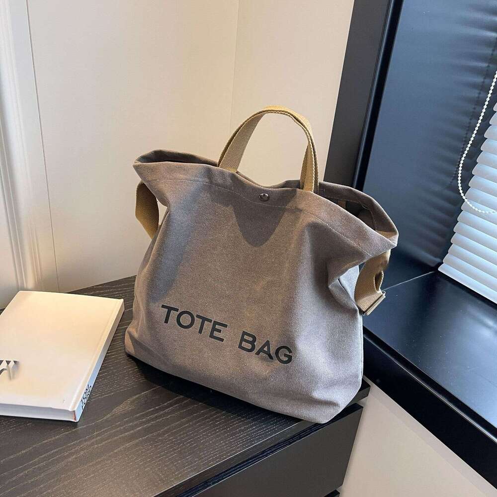 Thick canvas vintage tote high-end handbag commuting large capacity student backpack shoulder bag 2025 new style chic and elegant temperament