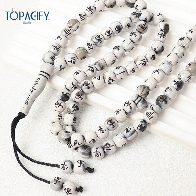 Muslim held in hand, counting 99 beads. Arabic bracelet prayer beads