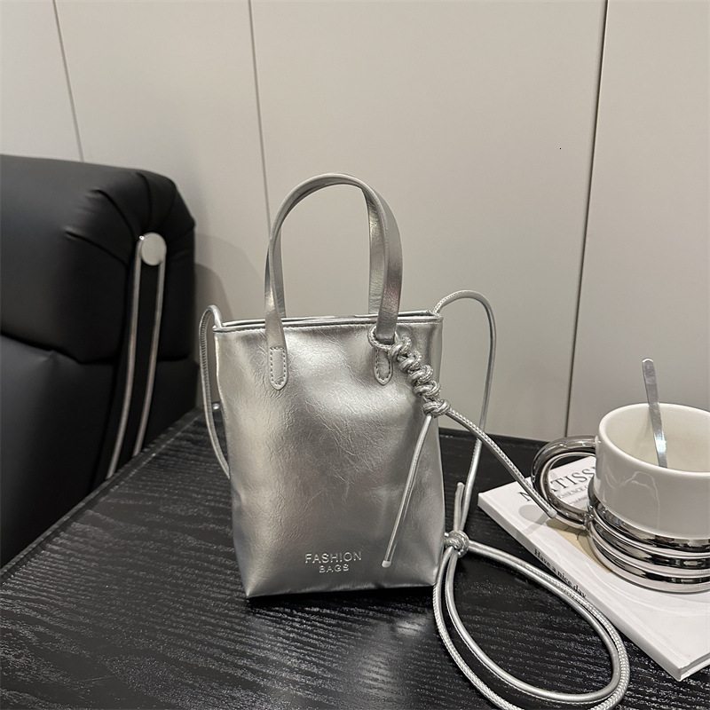 Free Delivery Designer Bag Small Holding Mobile Phone Fashionable And Versatile For Women Silver High End Feeling 2025 New Summer Handheld Shoulder Cr