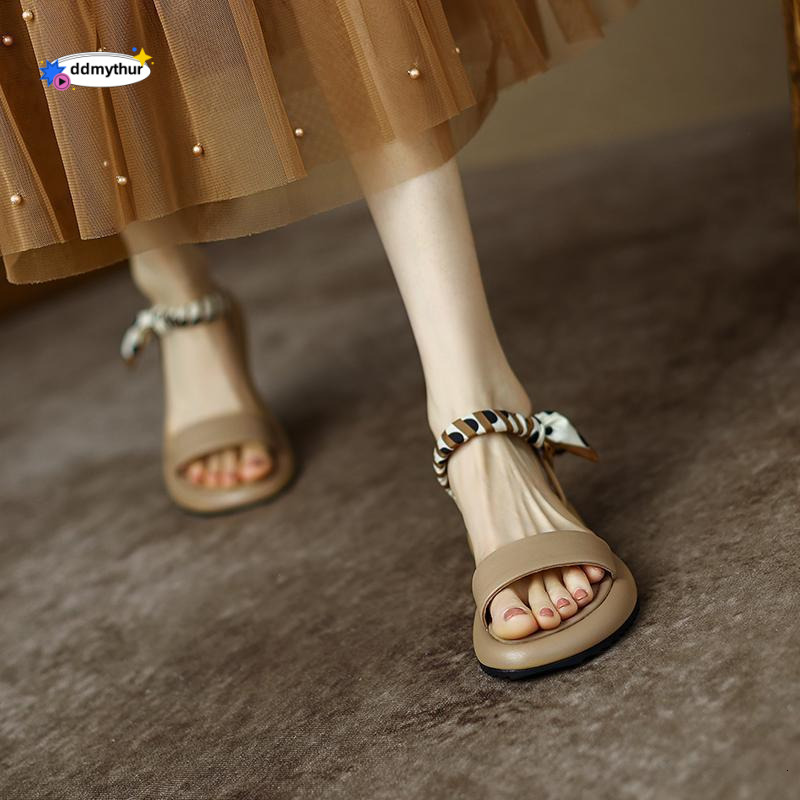 Sandals women in summer 2025, perfect for outdoor wear. This year's new style features Roman shoe with flat bottom and a thick sandy sole that fe