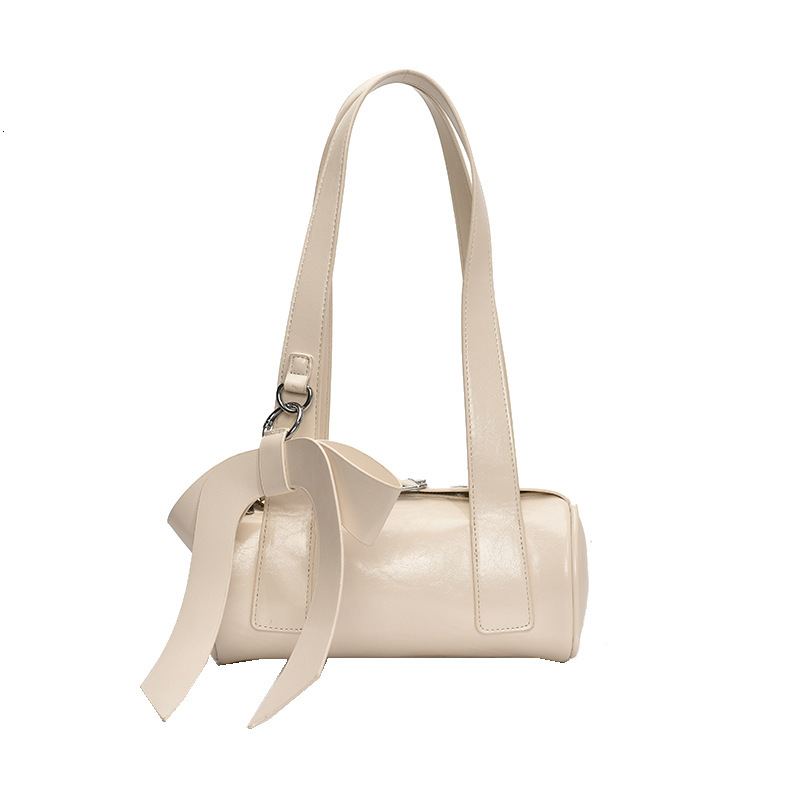 Niche bow hand-held small for women 2025 new trendy and fashionable texture armpit bag, summer minimalist baguette bag