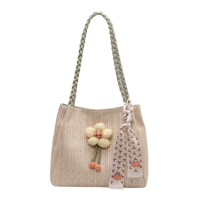 A new designer bag woven for women in the summer of 2025, featuring a large capacity seaside vacation single shoulder slanted transportation tote bag