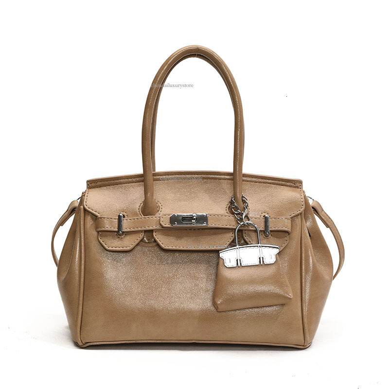 2025 Free Shipping Designer Women's Bag High-end Texture Large Capacity Handbag Fashionable Buckle Strap Single Shoulder Crossbody Bag Casual Com