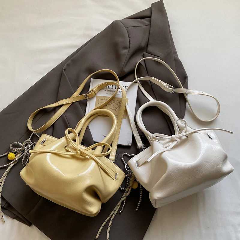 Summer Portable Basket Bag Wen 2025 Designer Bow Shoder Messenger Bag Lipstick Bag Storage Wing Shape Wallet With Pendant Z250514