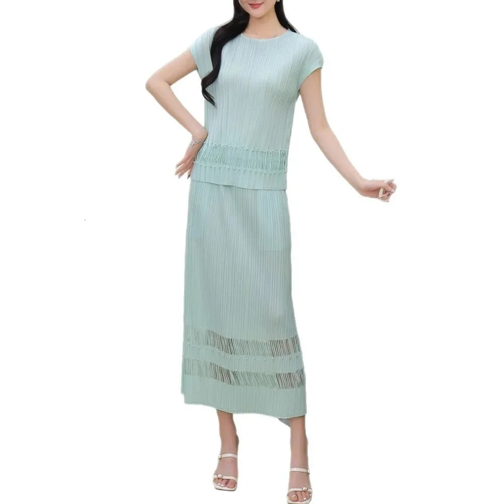 Miyake Style Pleated Fashionable Casual and Versatile Suit for Women Summer Round Neck Top Hollow Skirt Twopiece Set 250514