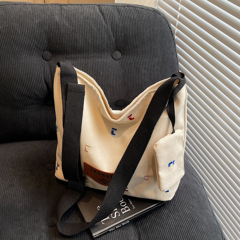 2025 Winter Large Capacity Shoulder College Student Girls Leisure Versatile Canvas Bag Wear New Free Delivery Designer Luxury Bag Resistant And Waterp