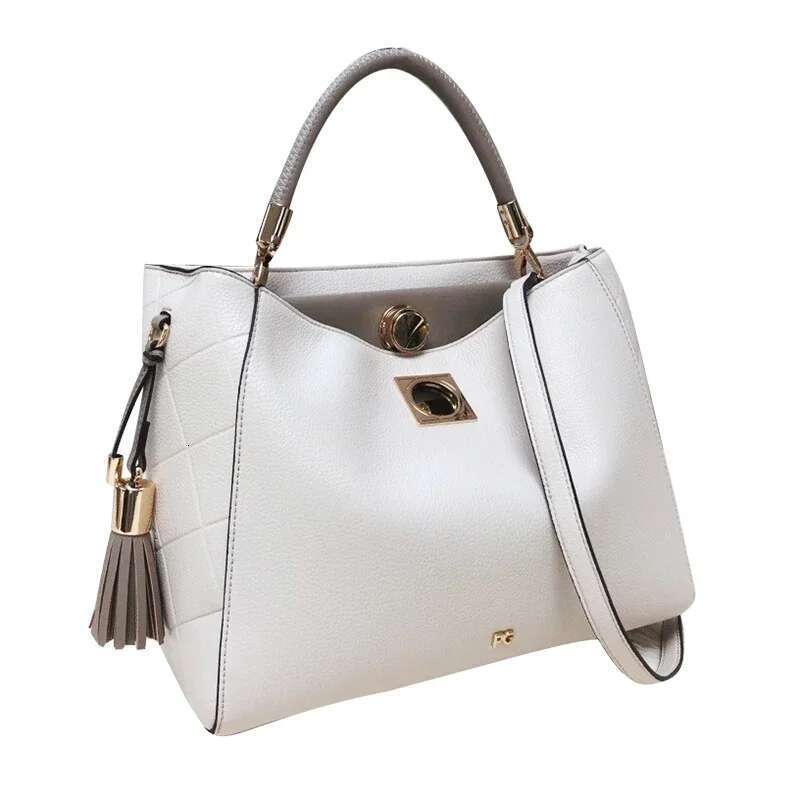 PG Fashion Elegant Popular Ladies Handbag Can Crossbody Niche Bags Unique Skeleton Buckle With Tassel Pendant New Brand Design