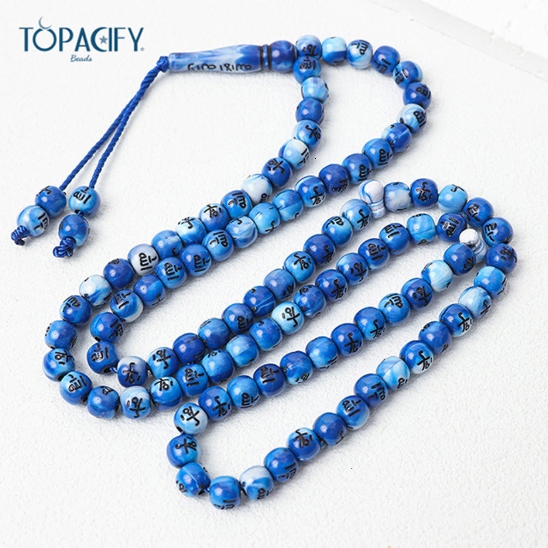 Muslim held in hand, counting 99 beads. Arabic bracelet prayer beads