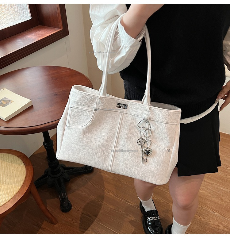 2025 Free Shipping Designer Women's Bag High Quality Fashion Leisure Niche Pocket Handbag Work Commuter Single Shoulder Crossbody Bag Large Shopp