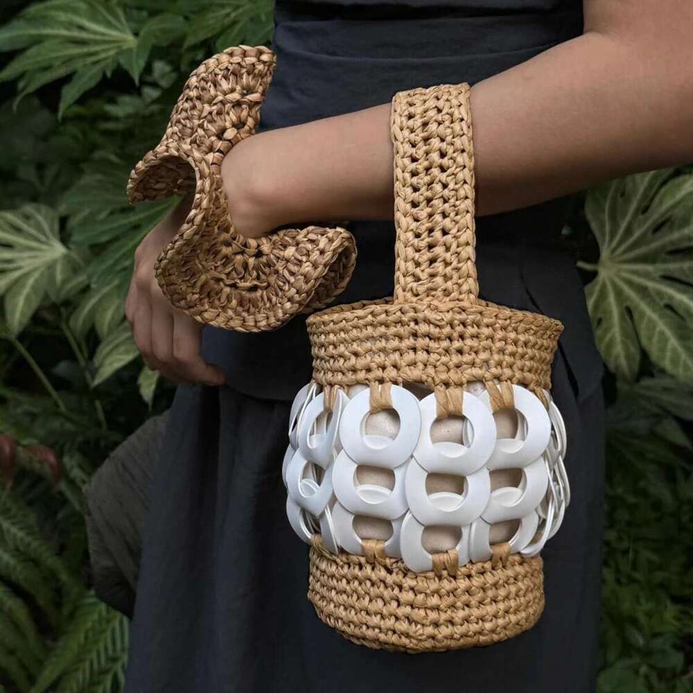 The Handcrafted, Nature-Inspired Woven Straw Bucket Bag With Intricate Cutouts