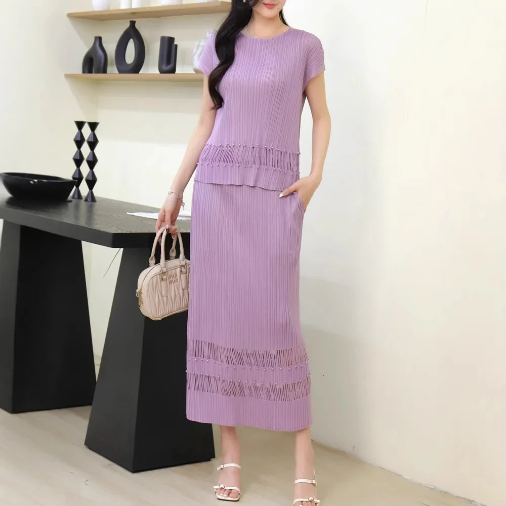 Miyake Style Pleated Fashionable Casual and Versatile Suit for Women Summer Round Neck Top Hollow Skirt Twopiece Set 250514