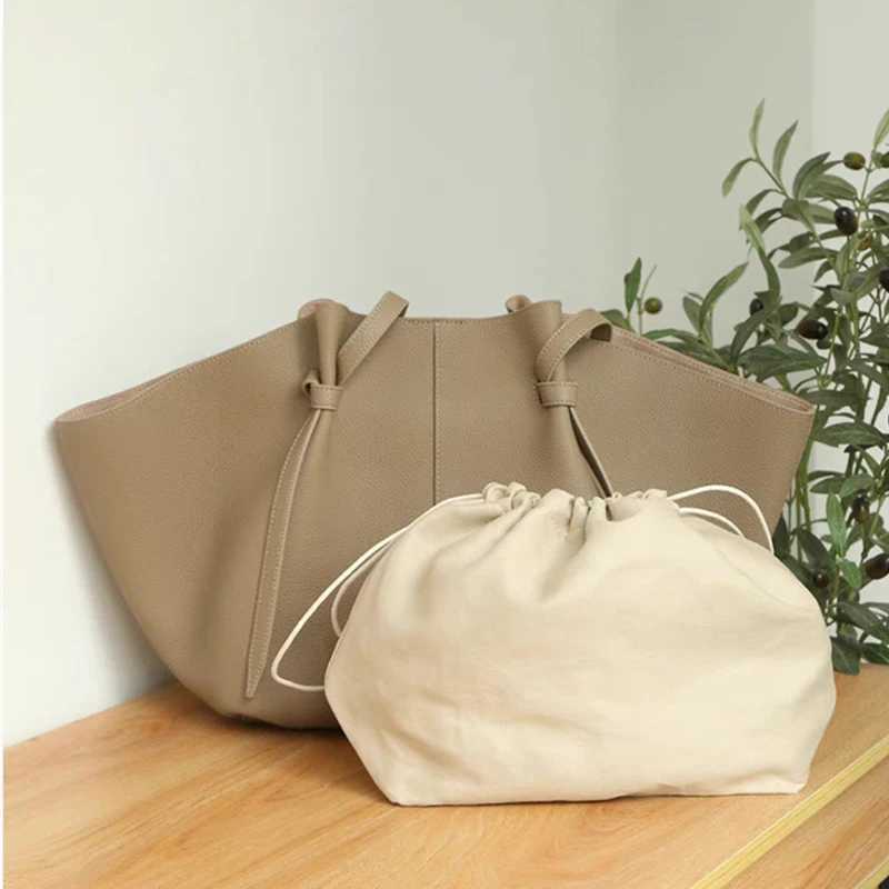 Top Layer Cowhide Large Capacity Tote Bag Wens Leather Bag Women Bat Bag Versatile Cmuter Bag Handheld Wing Cposite Bag Z250514