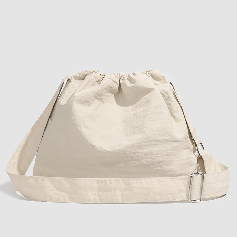 Large capacity drawstring sports wind dumpling bag lightweight small niche tote commuting versatile shoulder crossb 250514