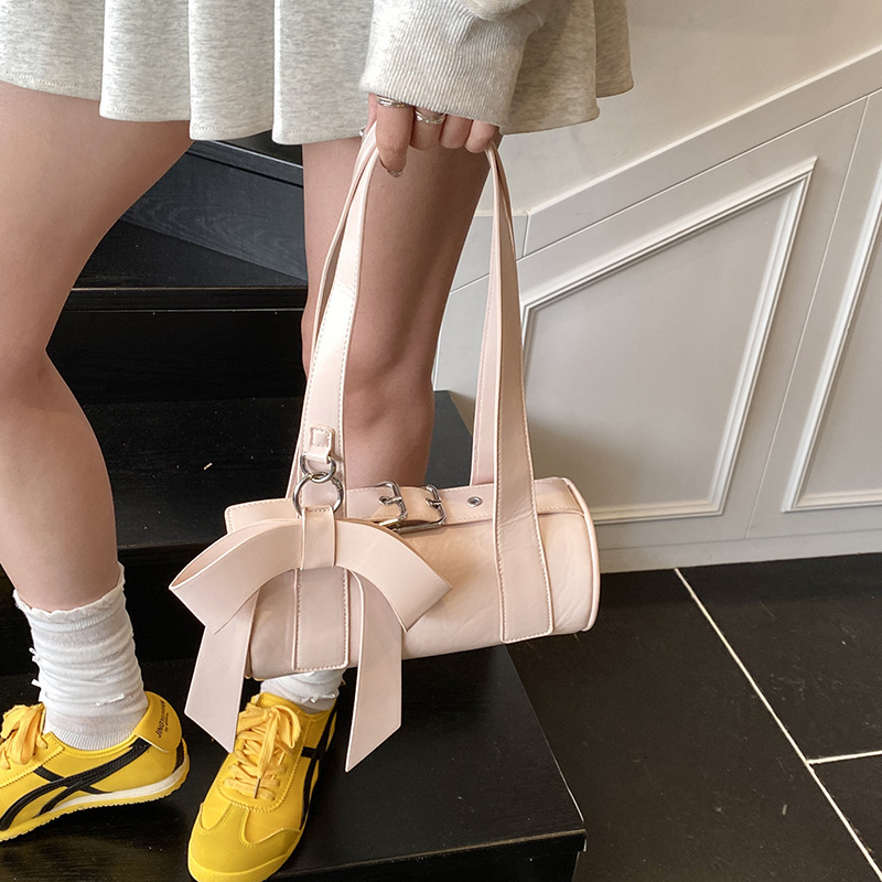 Niche bow hand-held small for women 2025 new trendy and fashionable texture armpit bag, summer minimalist baguette bag