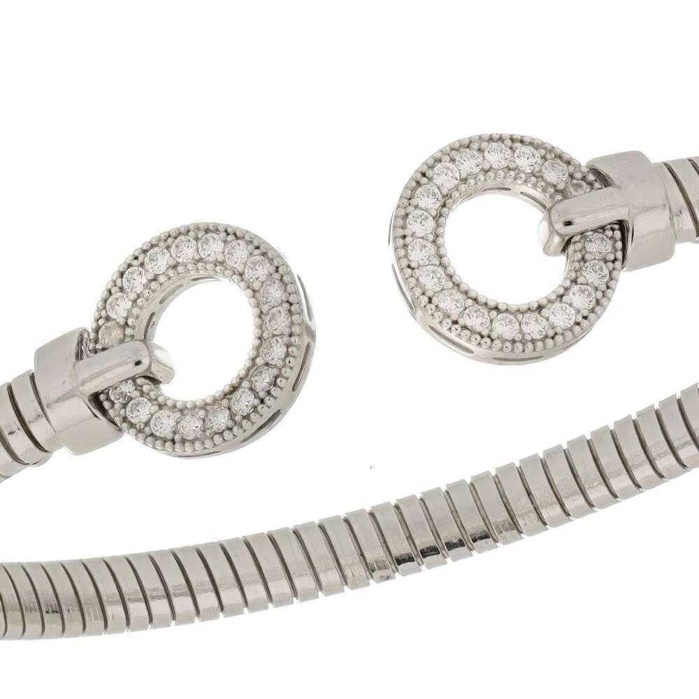 Made Italy, this elegant sier cuffed bracelet features circular micro paving details and is handmade in a modern style