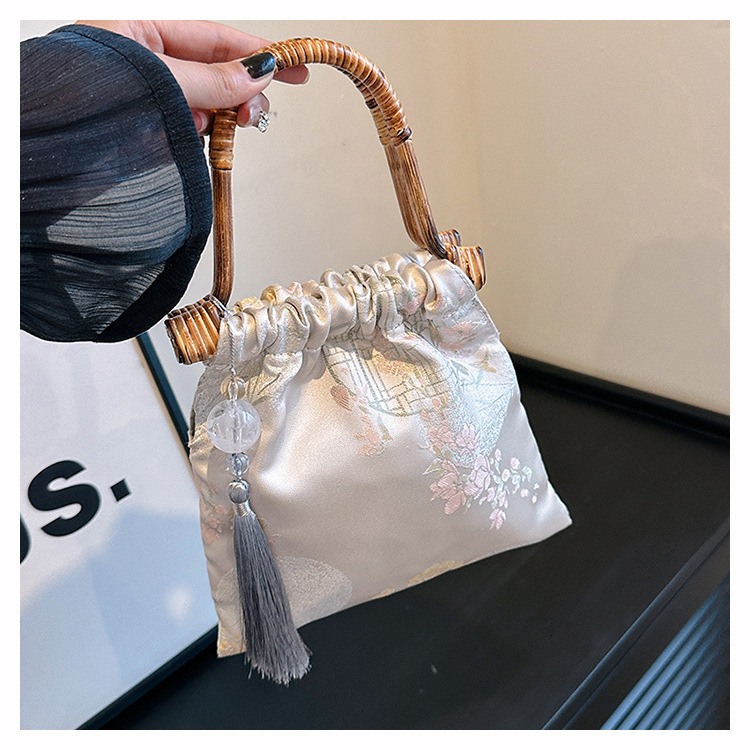 2025 new bag, new Chinese style horse face skirt, qipao, Hanfu, ancient rattan weaving, hand-held bamboo designer, ethnic style, handmade jacquard bag
