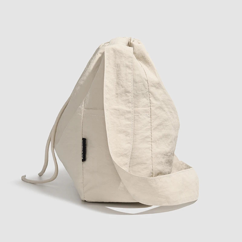 Large capacity drawstring sports wind dumpling bag lightweight small niche tote commuting versatile shoulder crossb 250514