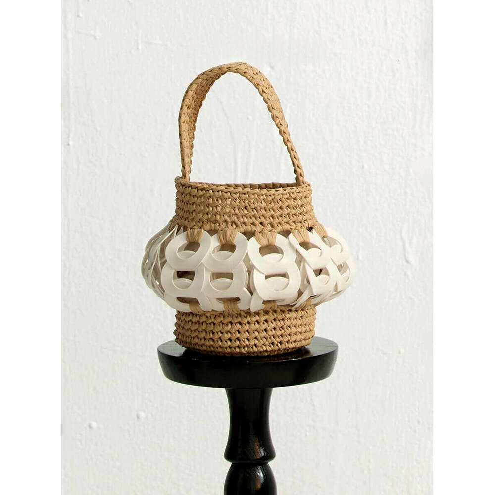 The Handcrafted, Nature-Inspired Woven Straw Bucket Bag With Intricate Cutouts