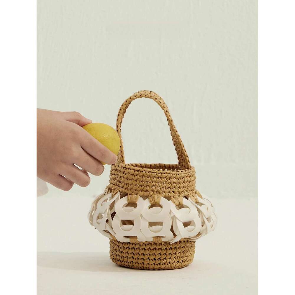 The Handcrafted, Nature-Inspired Woven Straw Bucket Bag With Intricate Cutouts