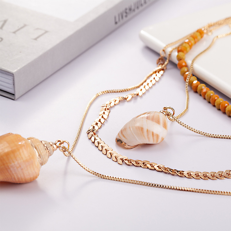 Multiple sets of snail shell crystal chain necklaces for direct sale