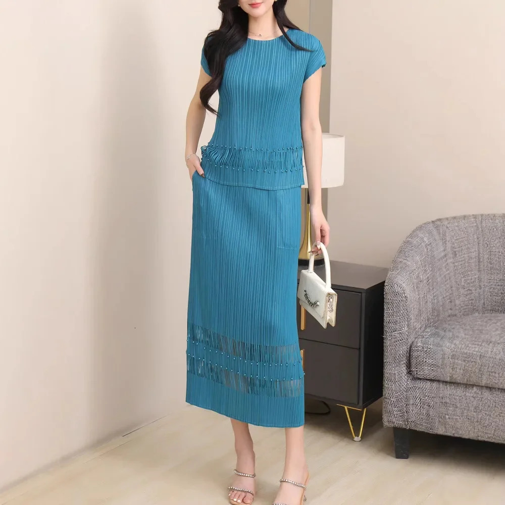 Miyake Style Pleated Fashionable Casual and Versatile Suit for Women Summer Round Neck Top Hollow Skirt Twopiece Set 250514
