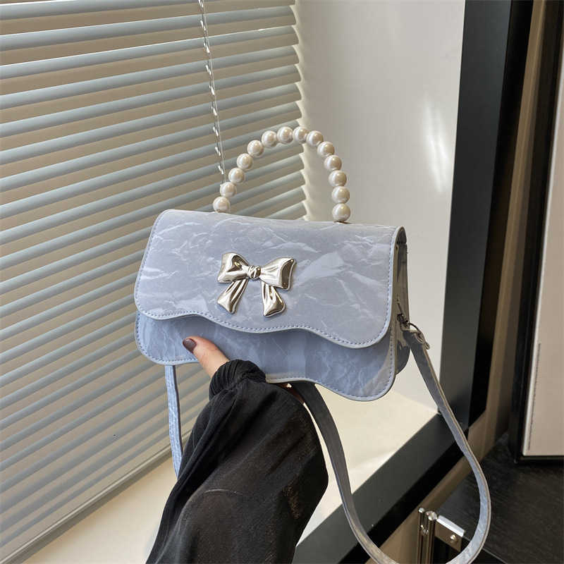 Free Delivery Designer Bag 2025 Fashion Pearl Handheld Stylish Solid Color Design Fresh Butterfly Texture Crossbody Bag Luxury Bag